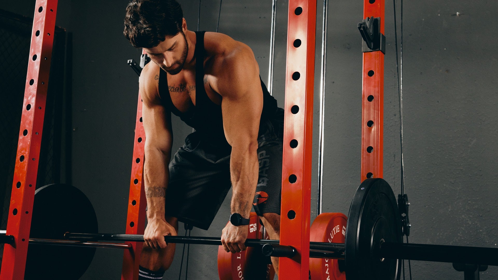 a strong man in the power rack for deadlift